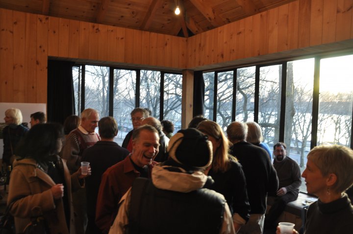 People gather inside of the Volunteer House in Riverside Park