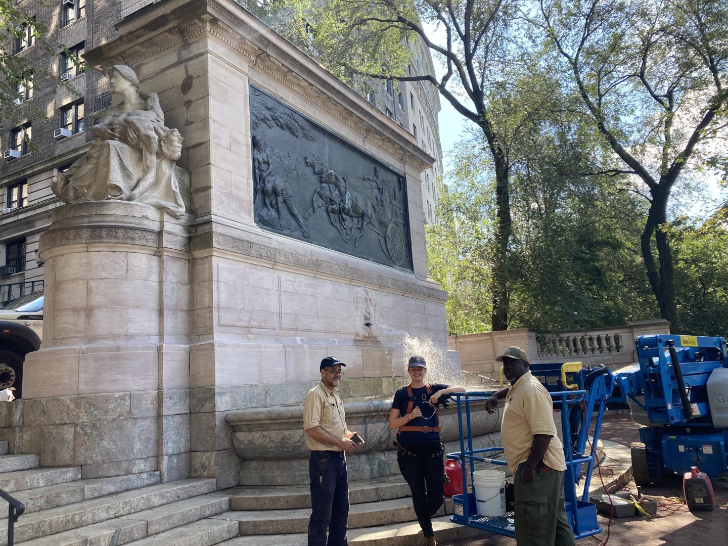 Monuments crew fixes the Firemen's Memorial at 100th Street