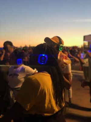 People dance at a silent disco on the Pier