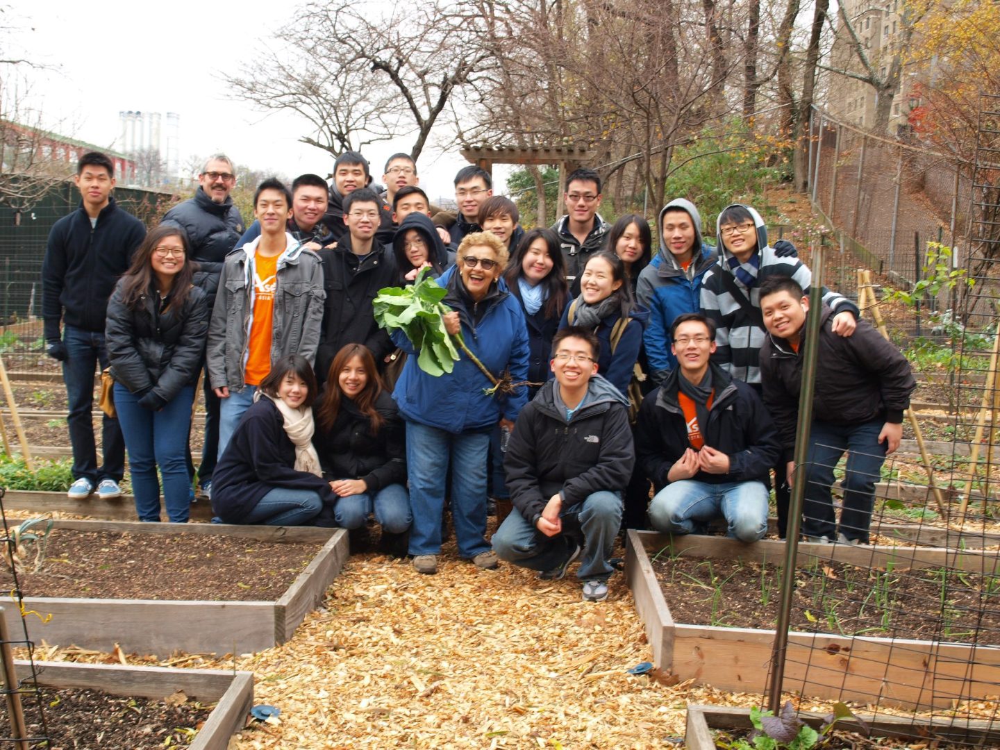 A group of volunteers poses in the Garden