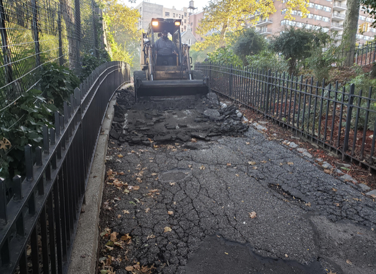 Equipment breaks up pavement in preparation of a repaving project