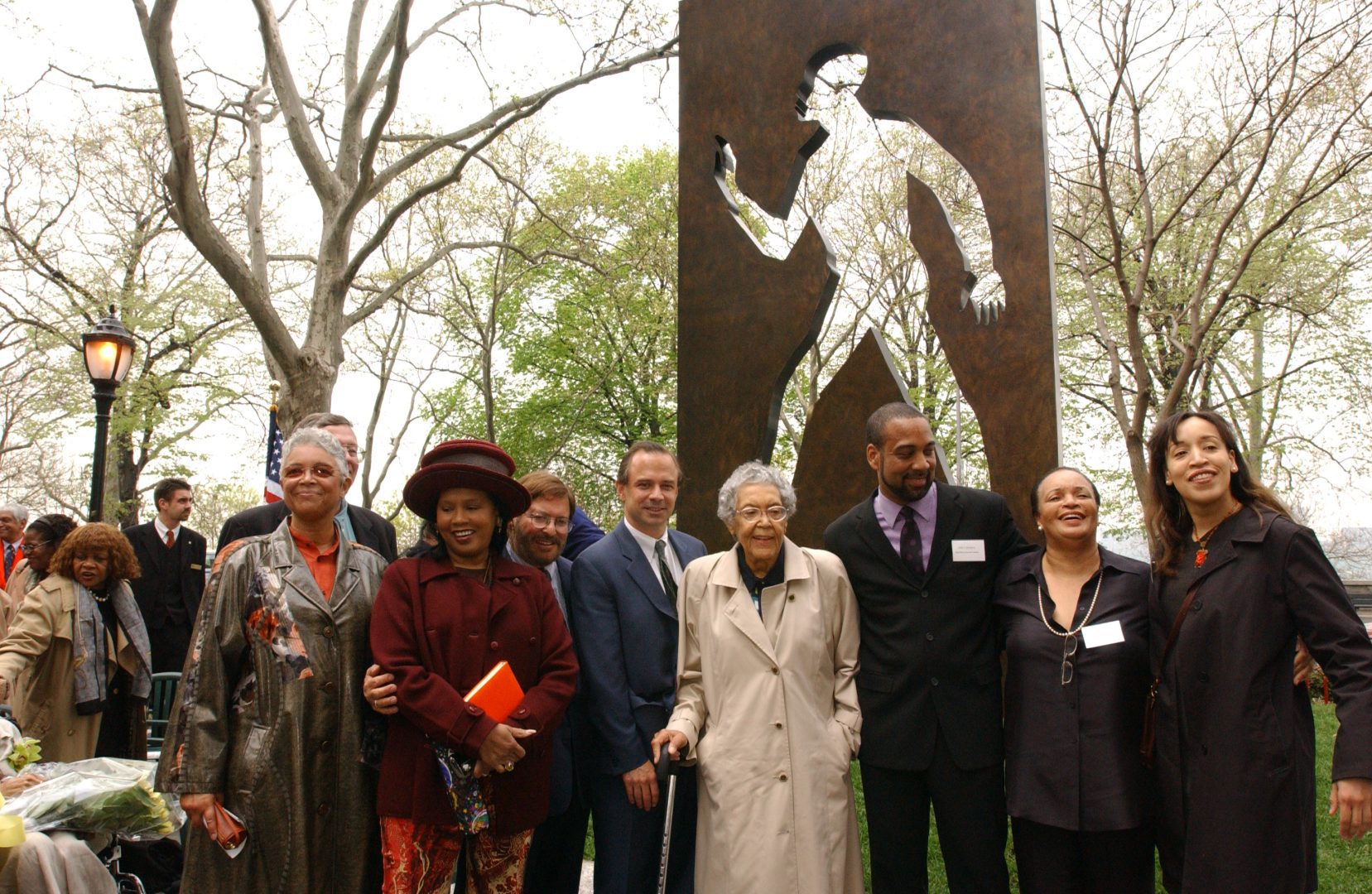 The Ralph Ellison Committee, elected officials, artist Elizabeth Catlett, and the public gather at the Ralph Ellison Memorial